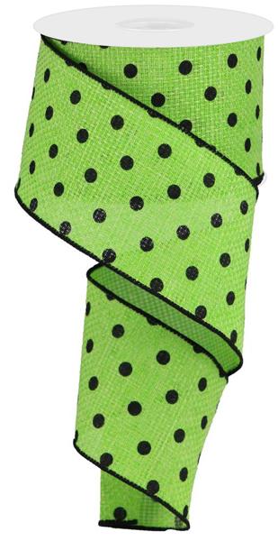 a roll of green and black polka dot ribbon