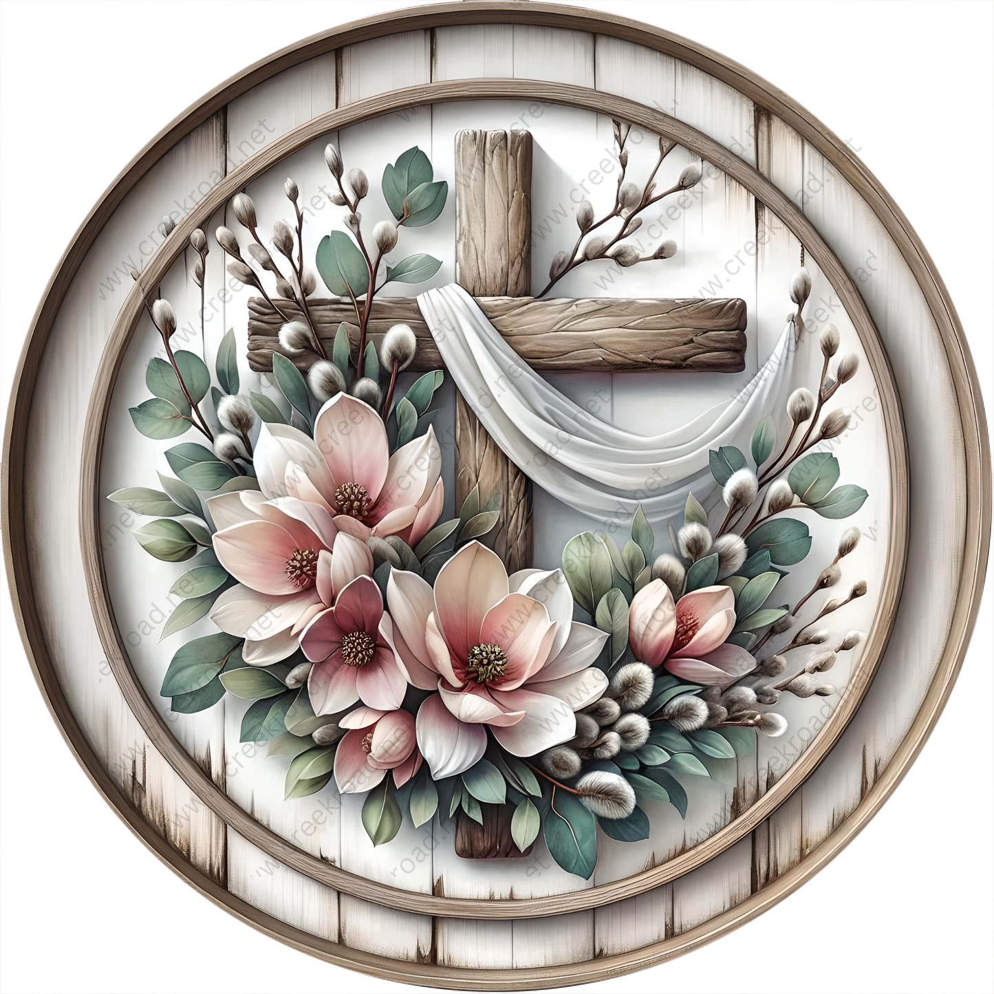 A wooden cross surrounded by a floral arrangement, including pink and white flowers, greenery, and a white cloth draped over the cross.