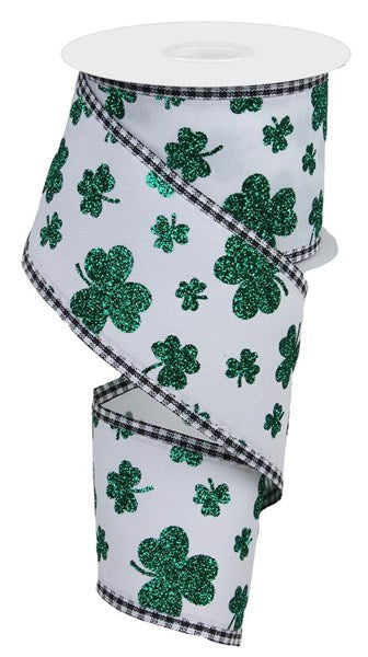 a roll of toilet paper with shamrocks on it