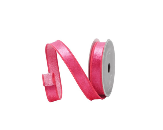 A pink ribbon is coiled and lying on a white background.