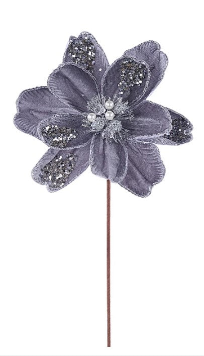 A purple flower with glittery petals and a brown stem.