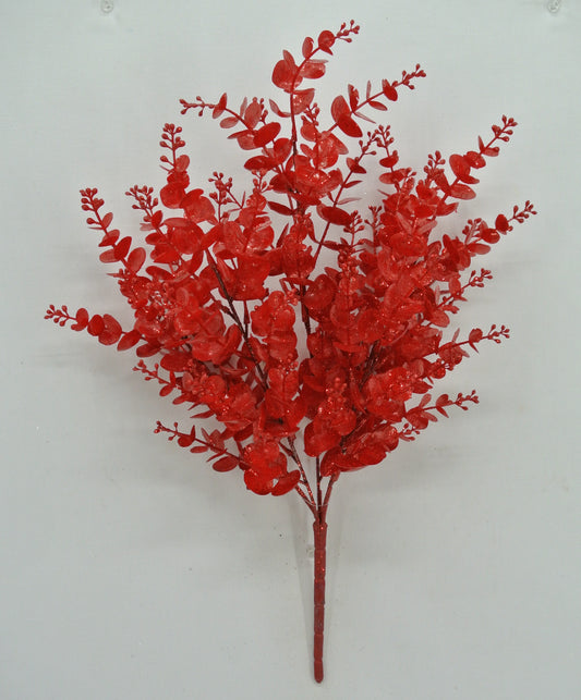 A vibrant red floral arrangement with numerous small leaves and branches, creating a striking and eye-catching display.