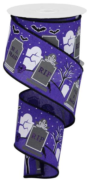 a pair of purple halloween ribbon with bats and tombstones on it