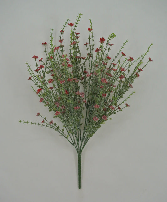 A bouquet of red flowers with green stems is displayed against a plain white background.
