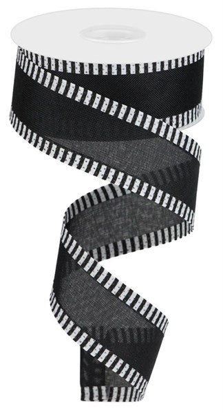 a roll of black and white striped ribbon