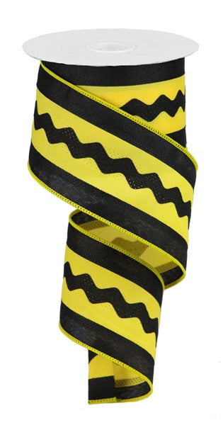 a roll of black and yellow ribbon on a white background