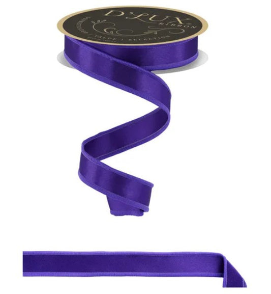 a purple ribbon with a gold label, which is a decorative ribbon with a metallic finish.