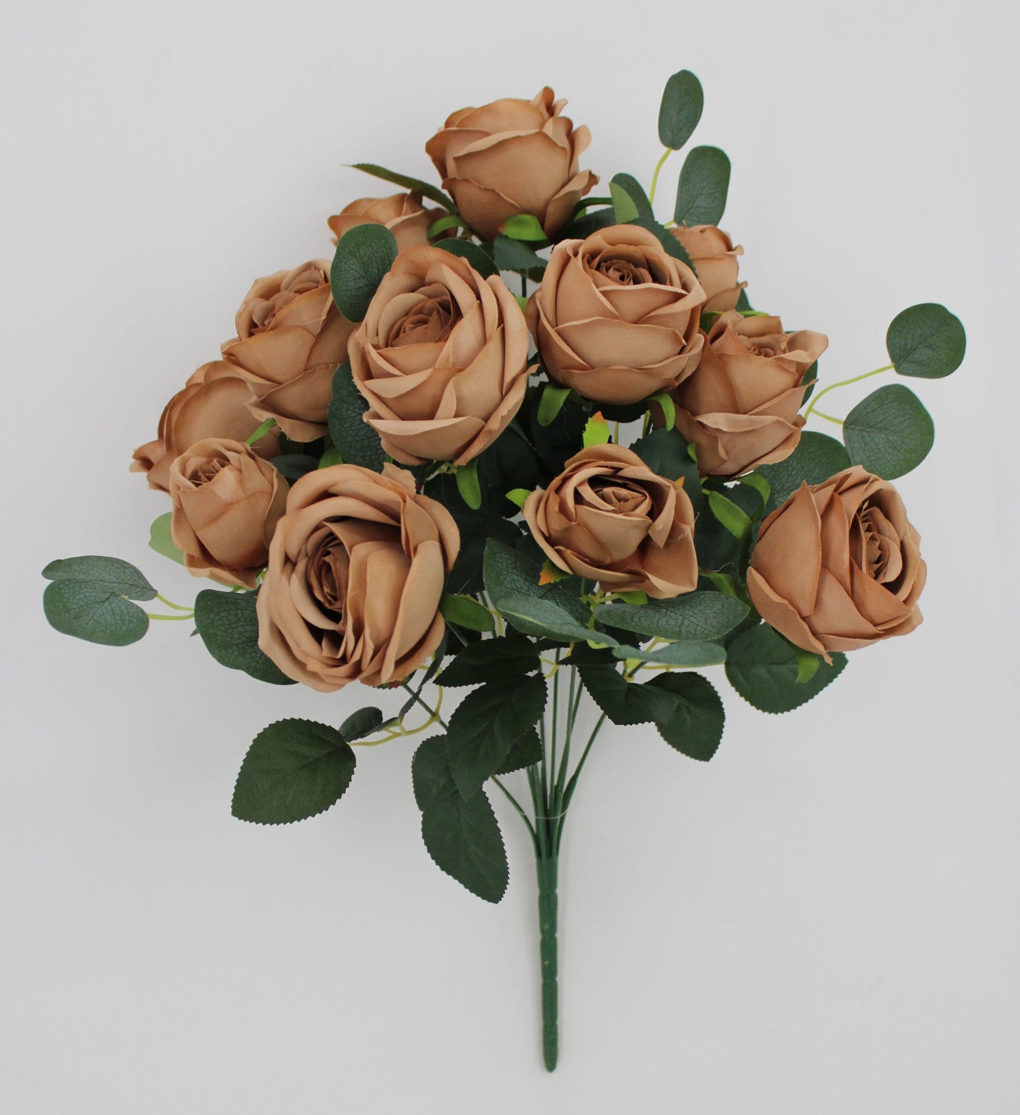 A bouquet of light brown roses with green leaves, arranged in a cluster.