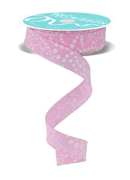 A pink and white polka dot ribbon is shown, with the ribbon winding around a spool of the same ribbon.