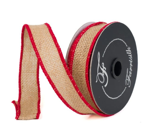 A spool of red and beige burlap ribbon with a black label on it.