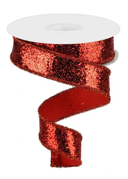 a roll of red glitter ribbon on a white background