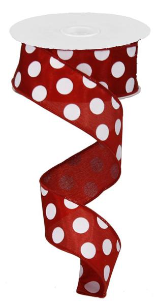 a roll of red and white polka dot ribbon