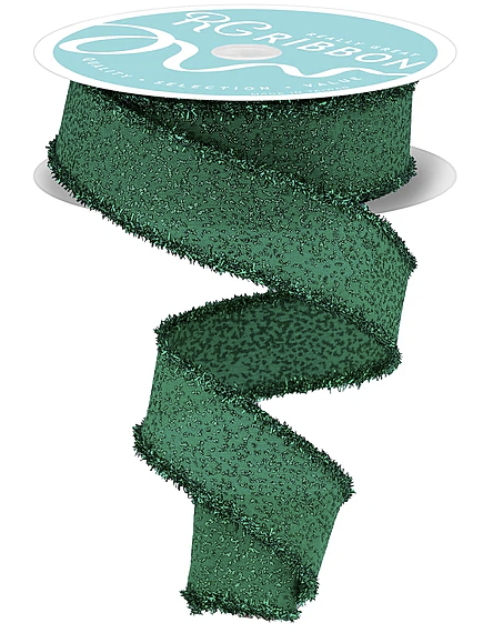 A green, textured ribbon with a spiral pattern, sitting on a white surface.