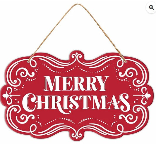 A red decorative sign with the text "MERRY CHRISTMAS" written in white cursive lettering.