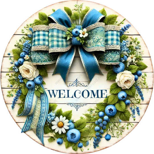 A decorative wreath made of blue and white flowers, ribbons, and leaves, with the word "WELCOME" prominently displayed in the center.