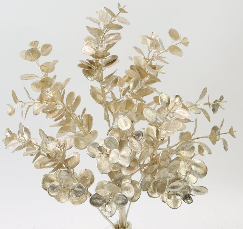 a bouquet of golden-colored leaves and branches, creating a visually striking and elegant arrangement.
