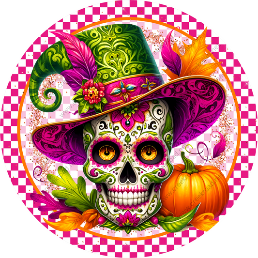 a skull wearing a colorful hat and a pumpkin
