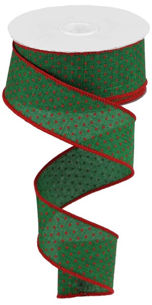 a roll of green and red ribbon on a white background