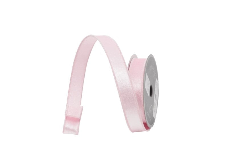 A pink satin ribbon is coiled and twisted in a spiral pattern against a white background.