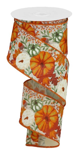 a roll of orange and white ribbon with pumpkins on it