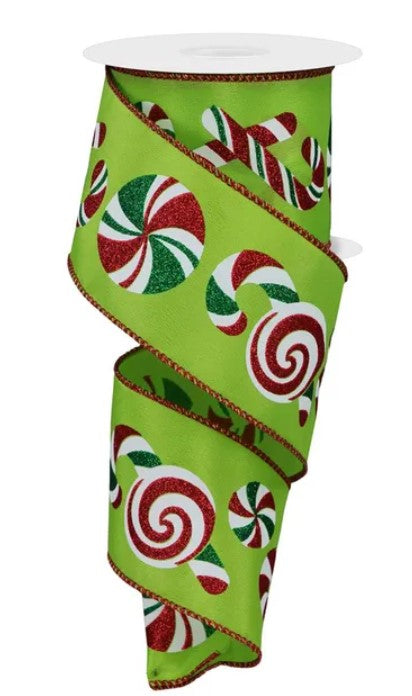A green ribbon with red and white candy canes printed on it.