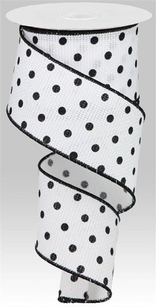 a roll of black and white polka dot ribbon