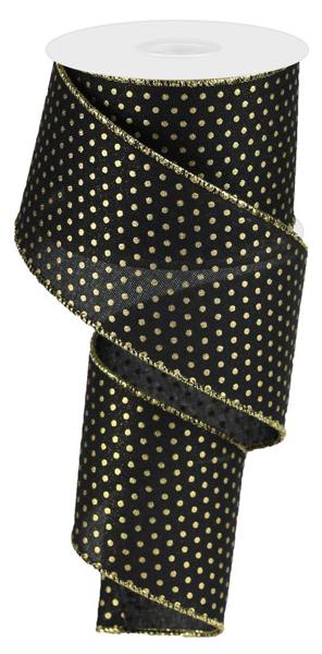 a roll of black and gold polka dot ribbon