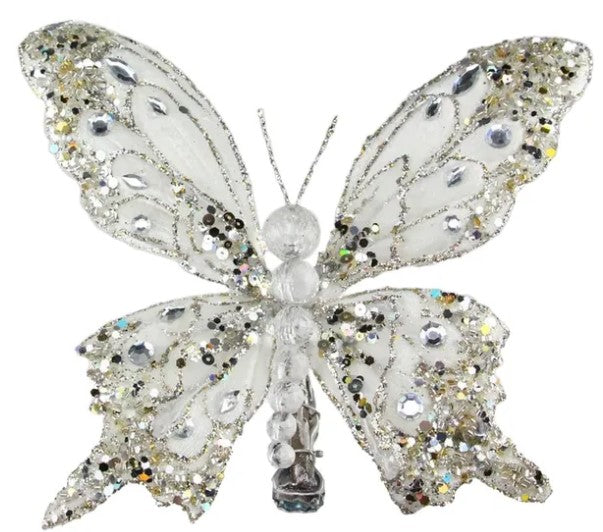 A silver butterfly with sparkling wings and a clear body, set against a white background.