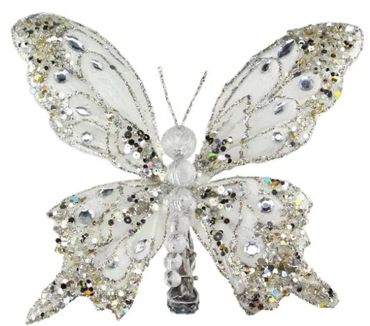 A silver butterfly with sparkling wings and a clear body, set against a white background.