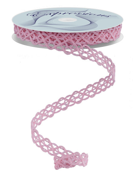 a spool of pink ribbon on a white background