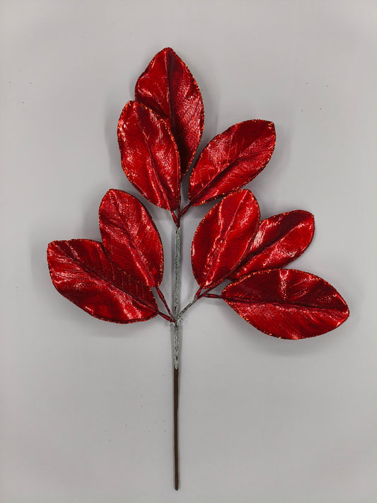 A branch with red leaves against a white background.