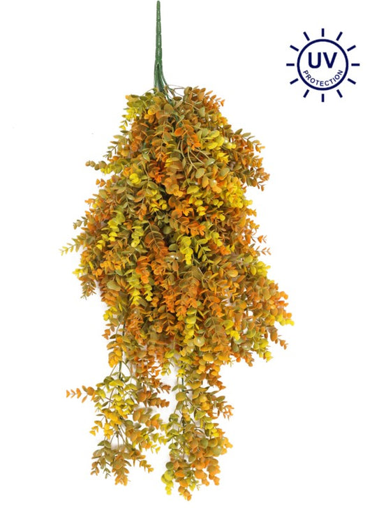 a bunch of yellow and green leaves hanging from a hook