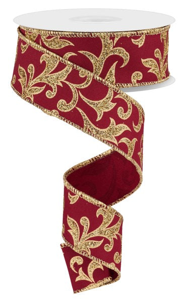 a red and gold ribbon with a gold design on it