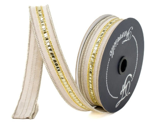 A spool of beige and gold decorative ribbon with a black label.