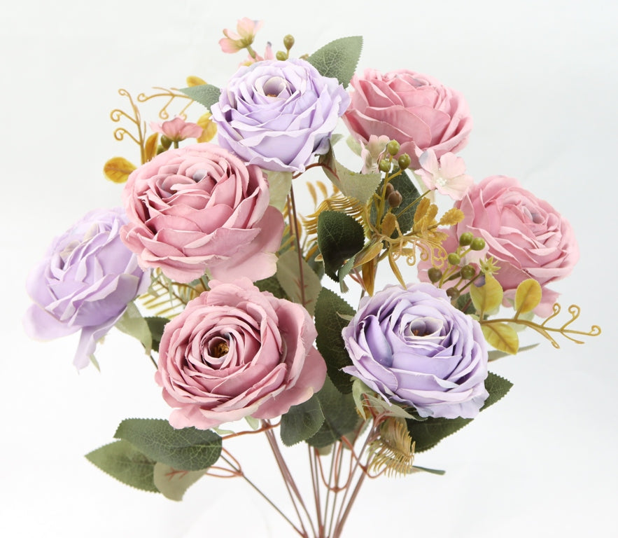 A bouquet of pink and purple roses with green leaves, arranged against a white background.
