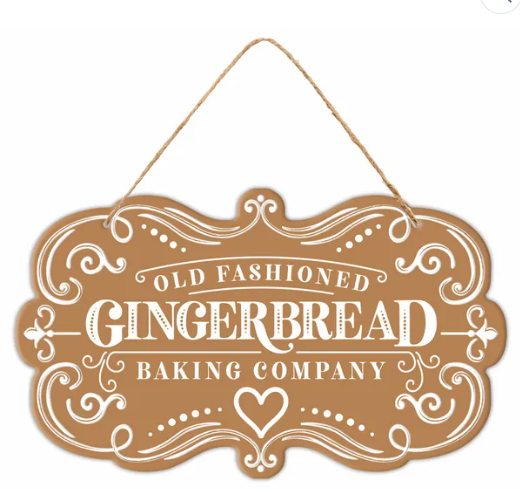 A wooden sign with the text "Old Fashioned Gingerbread Baking Company" hanging from a string.