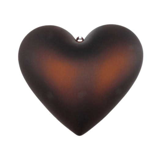 A dark brown heart-shaped object is shown against a white background.