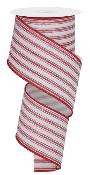 a roll of red and white striped ribbon