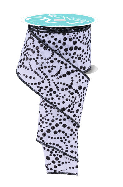 a black and white polka dot pattern on a ribbon.
