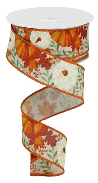 a roll of orange and white ribbon with flowers on it