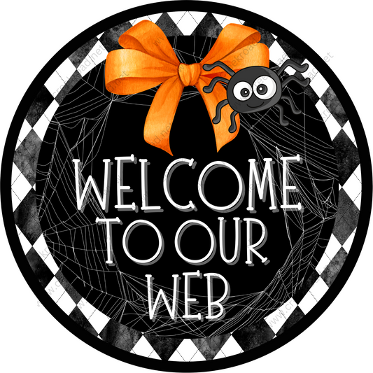 a welcome sign with a spider on it