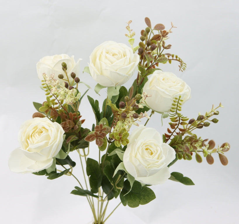 a vase filled with white flowers on top of a table