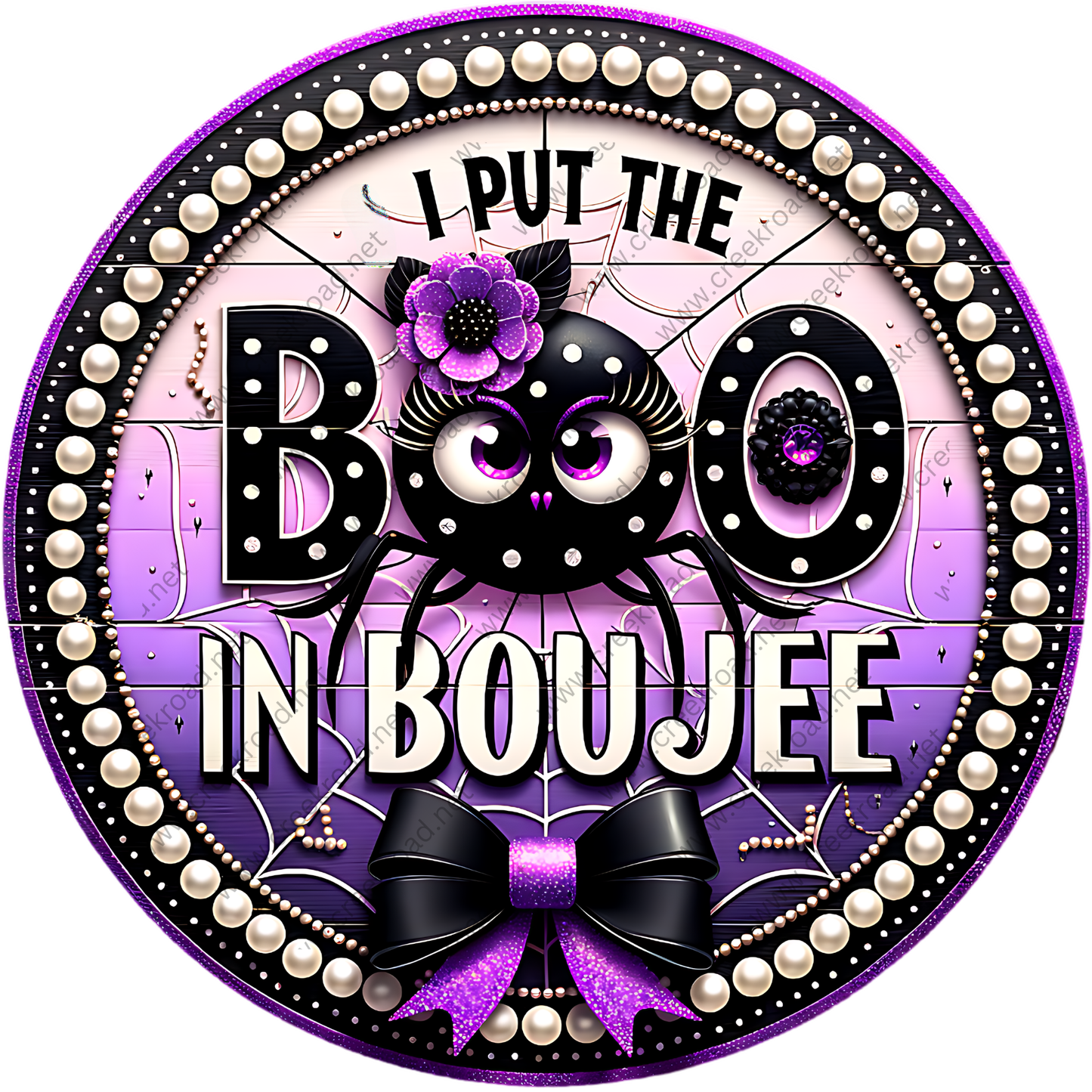 A circular design with a black spider and purple flowers, surrounded by a decorative border with pearls and a bow. The text "I PUT THE BOO IN BOUJEE" is prominently displayed in the center.