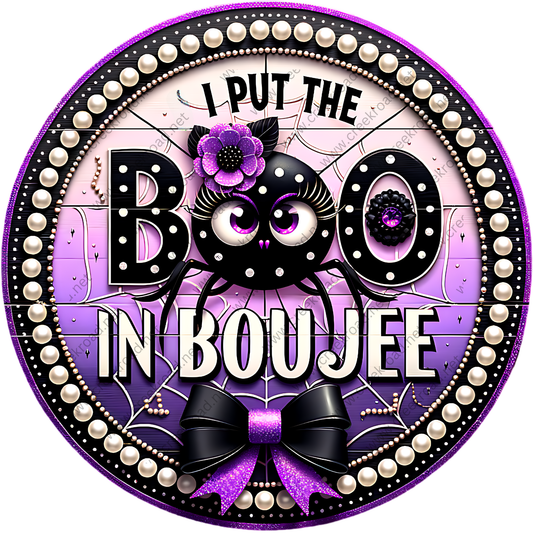 A circular design with a black spider and purple flowers, surrounded by a decorative border with pearls and a bow. The text "I PUT THE BOO IN BOUJEE" is prominently displayed in the center.