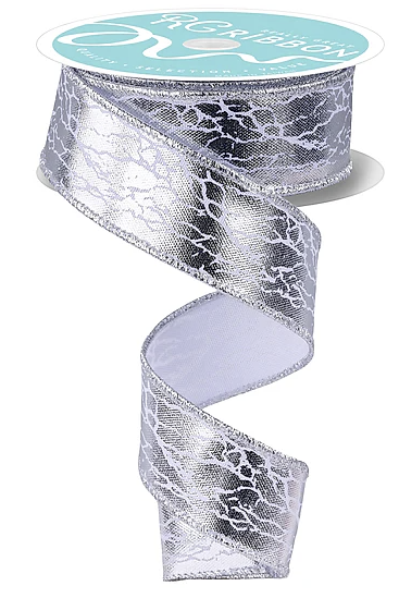 A silver and white metallic ribbon with a textured pattern, hanging from a spool.