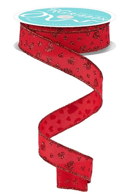 A red ribbon with a pattern of small hearts on it, with a turquoise label on top.