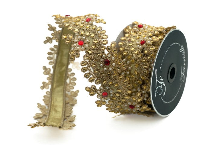 a gold-colored ribbon with a floral pattern and red accents, along with a spool of ribbon with a black label.