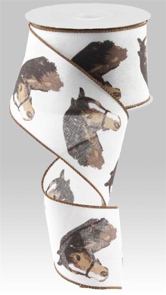 a roll of white ribbon with horses on it