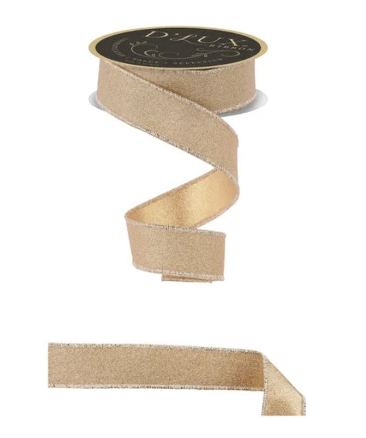a gold-colored ribbon with a black label, and a smaller piece of the same ribbon.