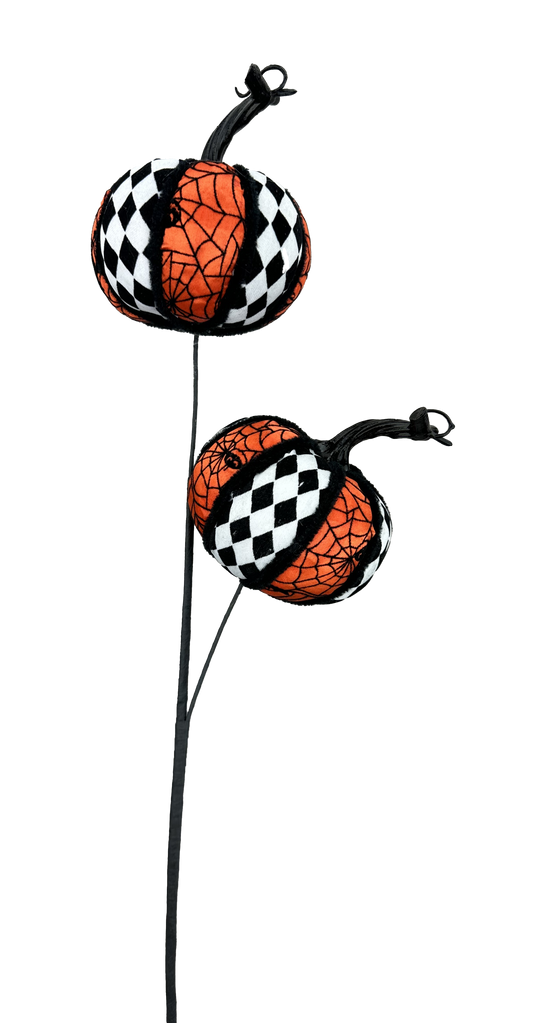 two decorative pumpkins with a black and white checkered pattern, hanging from a black pole.